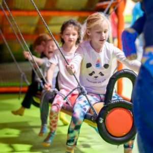 kids playing in indoor playground during a kids birthday party