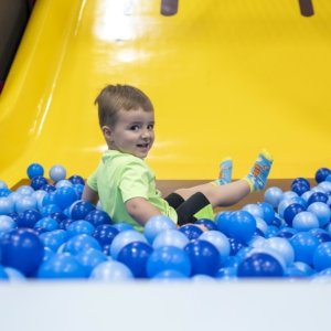 boy in ball pit